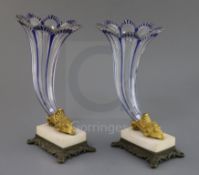 A pair of Bohemian blue flashed glass cornucopia vases, 19th century, each trumpet shaped vessel,