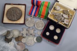 A collection of WWI and WWII General Service medals, costume jewellery and sundry coinage