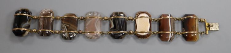 A Victorian gilt metal and banded agate set bracelet, 17cm.