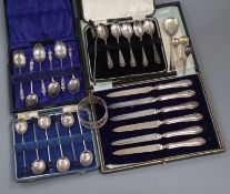 Four assorted cased sets of silver cutlery (one incomplete), five silver spoons and a silver