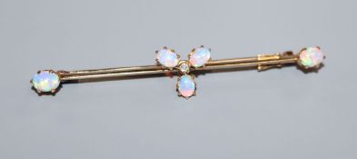 An Edwardian 15ct, white opal and diamond set cluster bar brooch, 58mm.