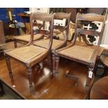 A set of four simulated rosewood beech cane seat dining chairs
