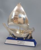 A 925 white metal model of a boat, cased, on presentation plinth, approx. 32cm.