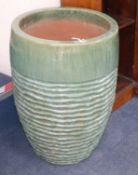 A large green glazed ribbed garden planter H.68cm