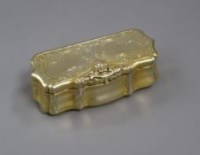 A 19th century Austrian gilt white metal snuff box of shaped rectangular form, engraved and engine-