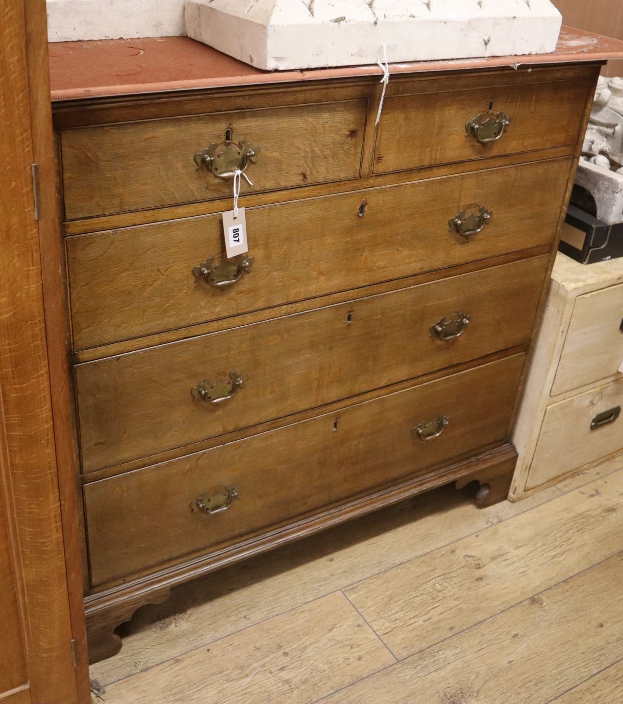 A George III oak chest of drawers W.100cm