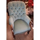 A Victorian mahogany spoonback armchair, with buttoned green upholstery