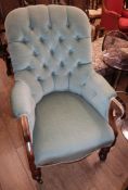 A Victorian mahogany spoonback armchair, with buttoned green upholstery