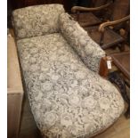 A Victorian oak upholstered chaise longue