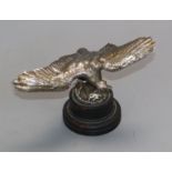 A plated eagle car mascot with indistinct mark Height 15cm