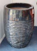 A ribbed gun metal garden planter H.68cm