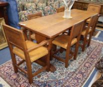 Thomas "Gnomeman" Whittaker of Littlebeck, a rectangular adzed oak dining table and six chairs (2