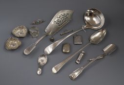 A George III bight cut engraved silver basting spoon, London, 1783 and other silver and plated