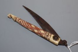 An Antique North American Indian? bone penknife, carved with a bird's head 16.5cm