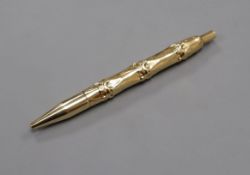 A Cartier style 14ct yellow metal 'bamboo' pattern ballpoint pen.