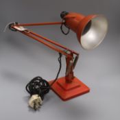 A 1960's orange anglepoise lamp