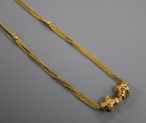 A late 19th/early 20th French 18ct two colour yellow metal double and triple chain necklace with