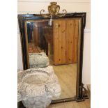 A 19th century parcel gilt ebonised wall mirror Height 124cm