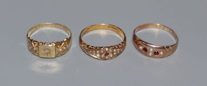 Two early 20th century 15ct gold and gem set rings and a 9ct gold and gem set ring.