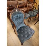 A Victorian walnut spoonback nursing chair together with four matching dining chairs