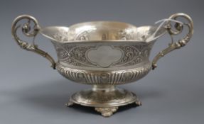 A late Victorian embossed silver two-handled shaped oval bowl, London, 1900, 29.5cm over handles,