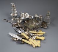 A silver sugar caster, silver sauceboat, silver condiment set, scent bottle, salt, napkin ring and
