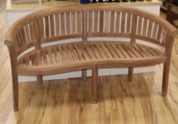 A teak garden bench W.160cm