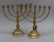 A pair of brass Menorah height 34cm