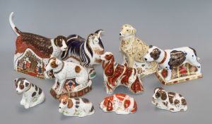 Ten Crown Derby paperweights: Labrador, Staffordshire Bull terrier, Collie, Spaniel, Foxhound,