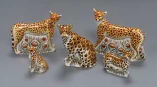 Five Royal Crown Derby paperweights - three cheetah's, leopard cub and leopardess