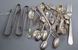 A collection of silver, continental white metal spoons including commemorative, two forks and