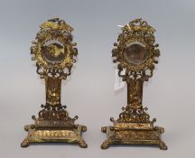 A pair of gilt metal pocket watch stands height 25cm