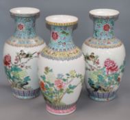 A pair of Chinese famille rose vases and another similar (3) Height 36cm