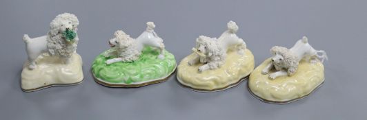 Four Samuel Alcock porcelain figures of poodles, c.1835-50, including a pair in crouching pose, L.