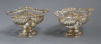 A pair of Victorian pierced silver pedestal bon-bon dishes by Charles Stuart Harris, London, 1993/4,