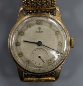 A gentleman's 1950's 9ct gold Tudor mid-size manual wind wrist watch, on associated flexible strap.