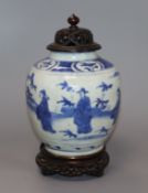 A Chinese Ming blue and white jar, Wanli period, hare mark, with hardwood stand and cover height