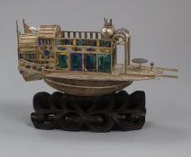 A Chinese white metal and enamel model of a junk, on hardwood stand, 14.5cm.