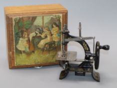 A German boxed child's sewing machine, early 20th century height 16cm