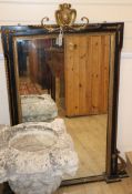 A 19th century parcel gilt ebonised wall mirror Height 124cm