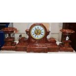 A 19th century rouge marble clock garniture height 42cm