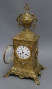 A cased brass mantel clock height 47cm