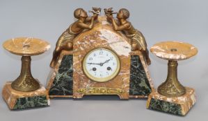 A French marble clock garniture with a boy and girl surmounts height 25cm