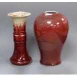 Two Chinese sang-de-boeuf vases, Qing dynasty, the first a Langyao gu shaped vase, H. 15cm and the