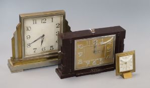 A chrome and brass mantel clock, Bakelite clock and an alarm clock