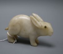 A 19th century Chinese white jade figure of a rabbit, glass inset eyes