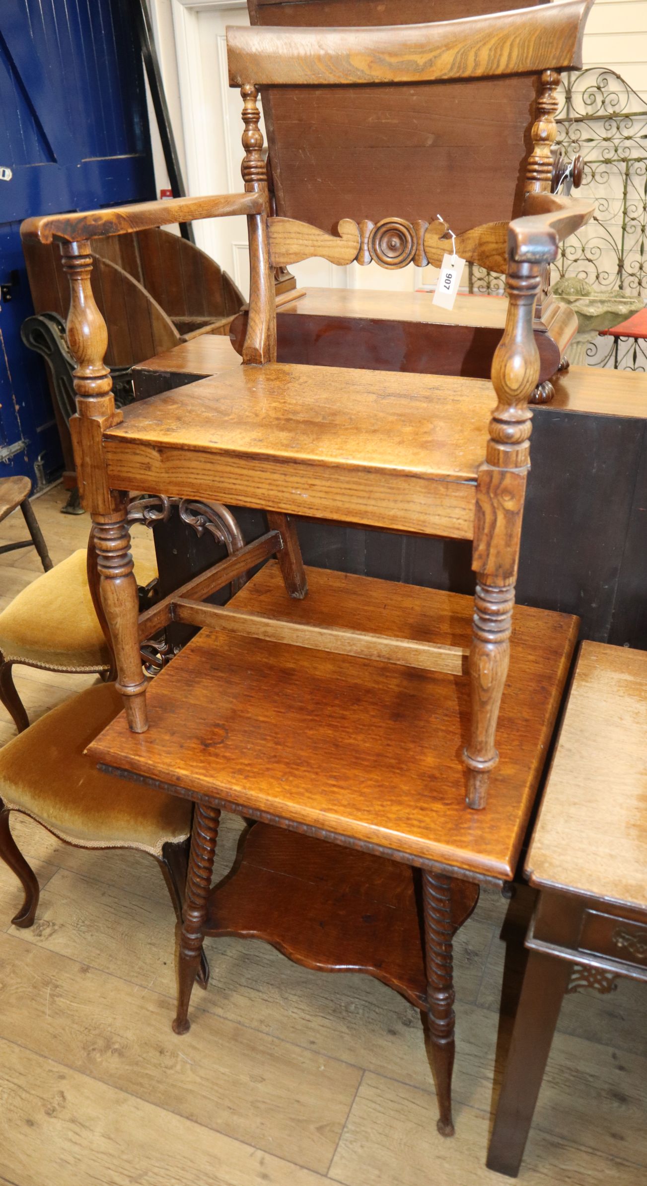 A Regency elm seat elbow chair and a late Victorian oak two tier occasional table Table W.67cm