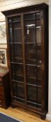 A 19th century brass mounted glazed oak narrow two door bookcase W.92cm