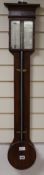 A mahogany stick barometer by G. Negretti, 4 Withy Grove, Manchester, with silvered scales and