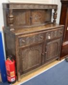 A 17th century style carved oak court cupboard W.123cm